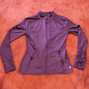 Maroon active wear jacket with thumb cut outs